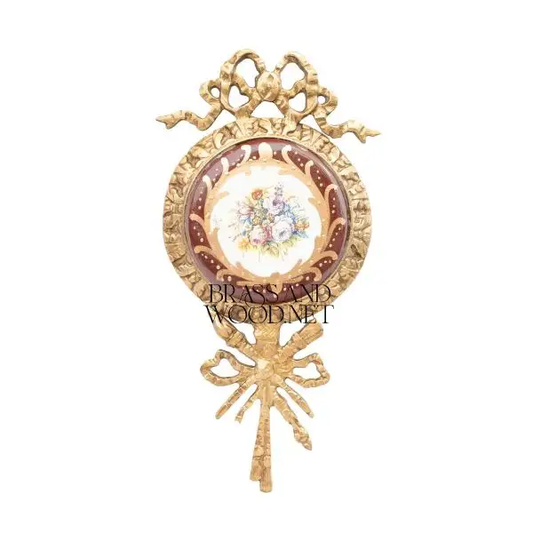 antique brass decorative ornate frame with porcelain floral bouquet painting red background ribbon design vintage home decor